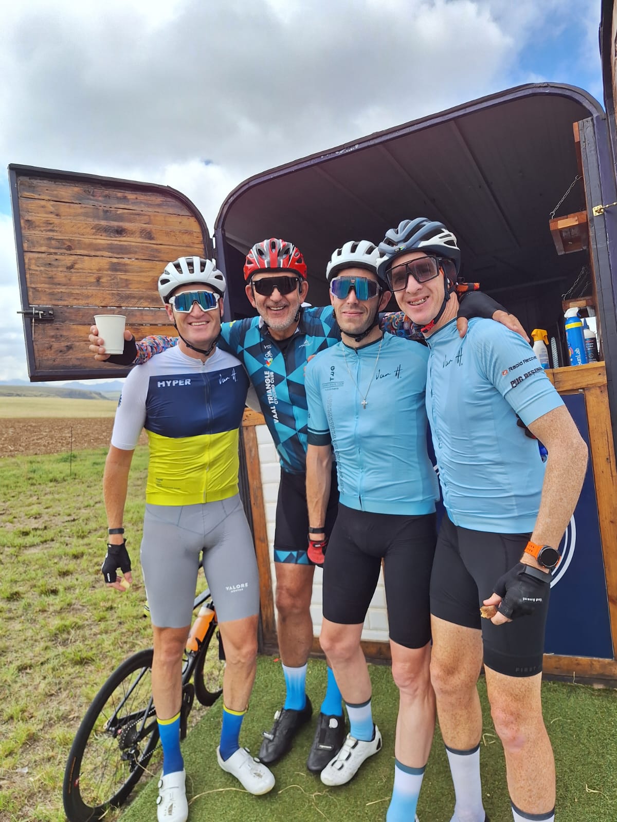 riders at water point on cycle tour
