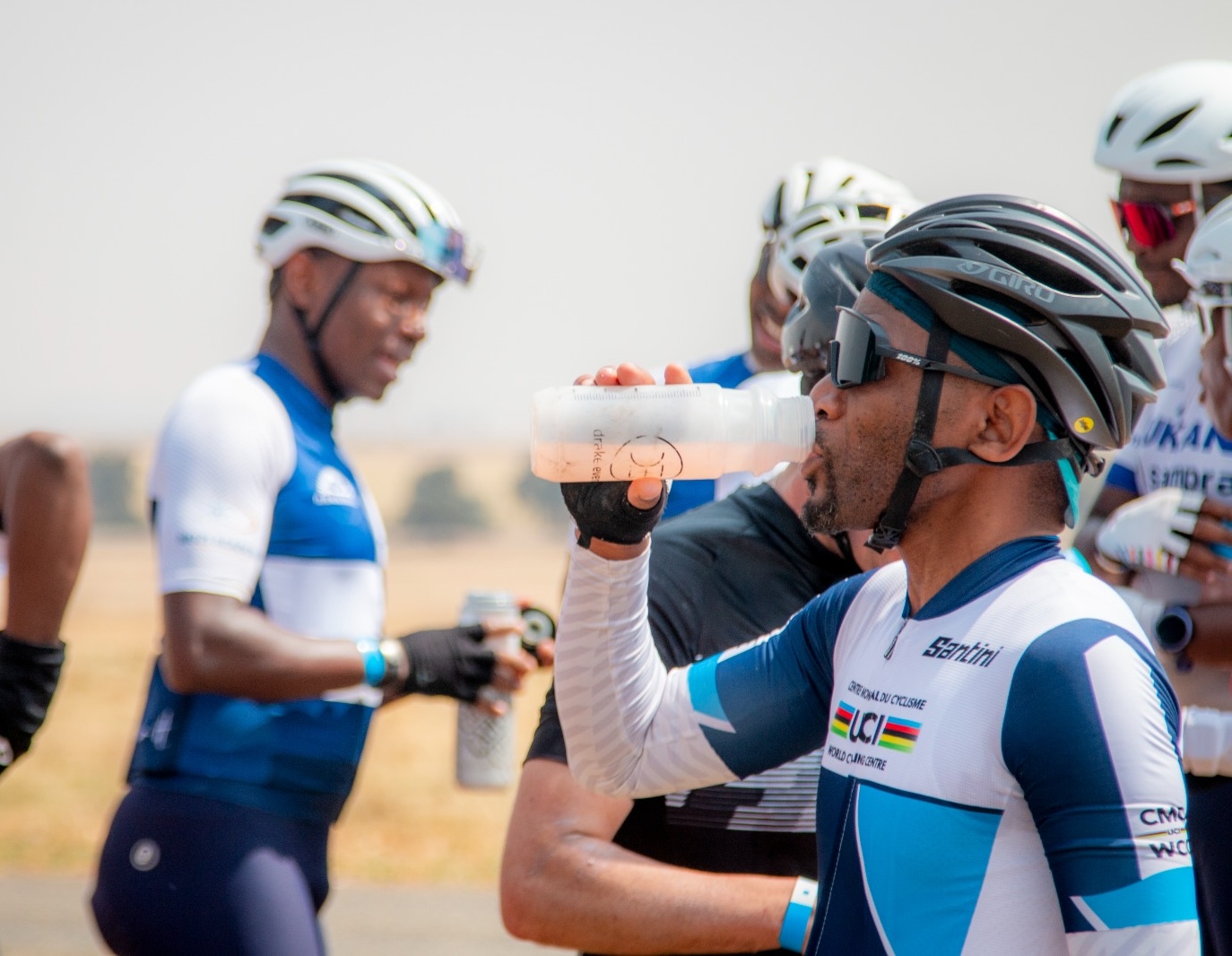 riders at water point