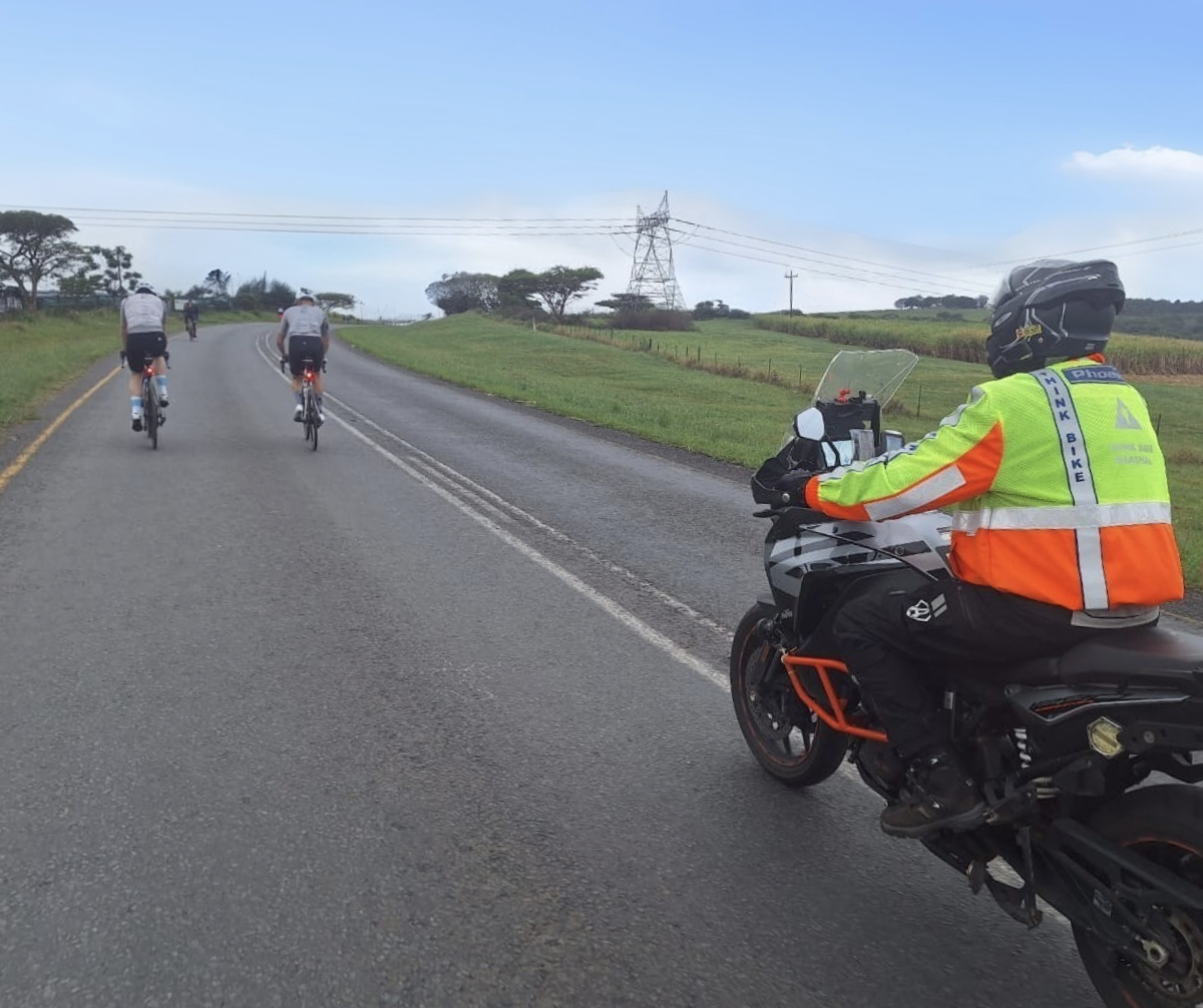 marshals protecting cyclists on tour